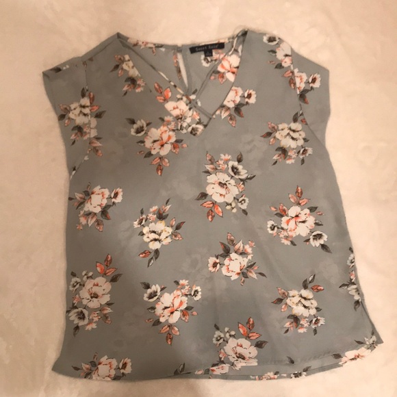 Am selling a light blue shirt with flowers on it. - Picture 1 of 2